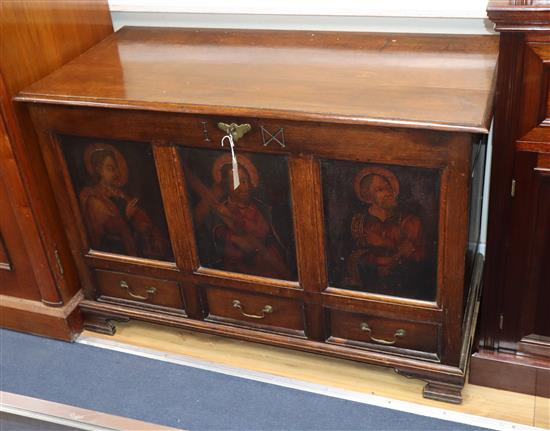 A mid 19th century oak mule chest, the front panels oil painted with three late 16th century studies of Saints, W.116cm